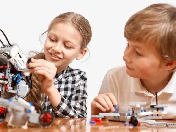 Joyful children assembling and playing with build-your-own robotic toys.